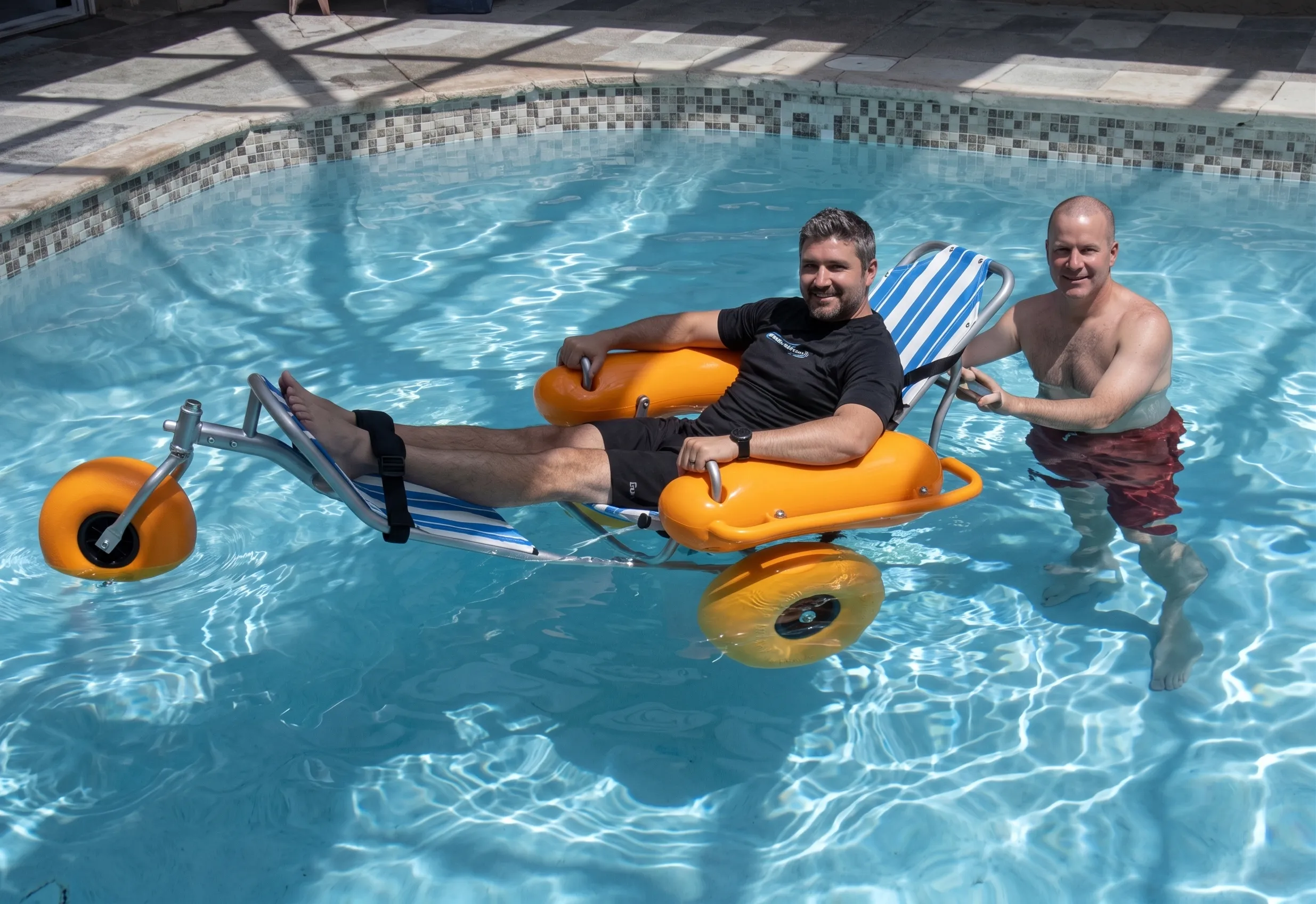 Floating Beach Wheelchair entering ocean water safely